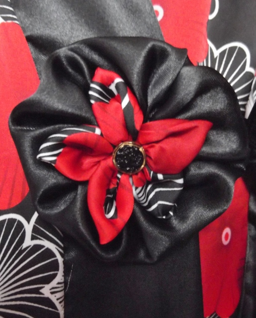 Red & black detachable rosette with black glass vintage button centre